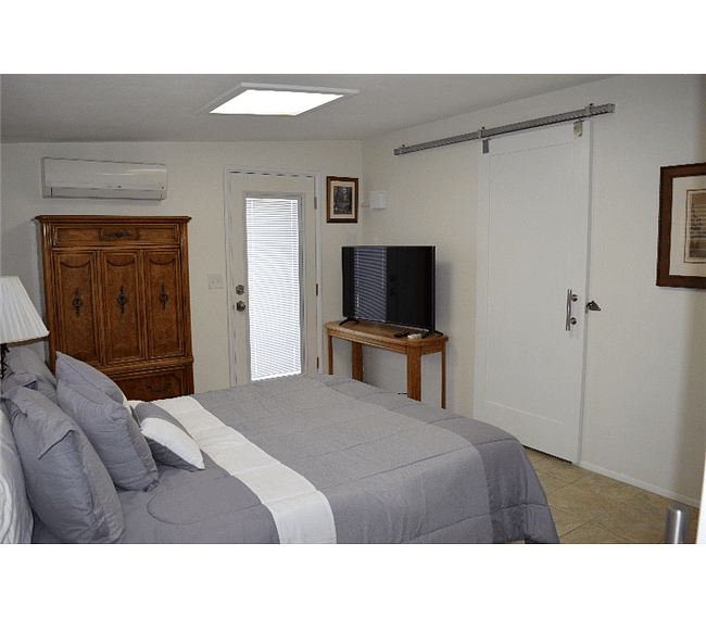 HDTV and Barn Doors In Master Bedroom
