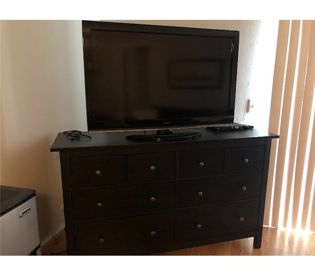Large Screen TV on Dresser located in your bedroom