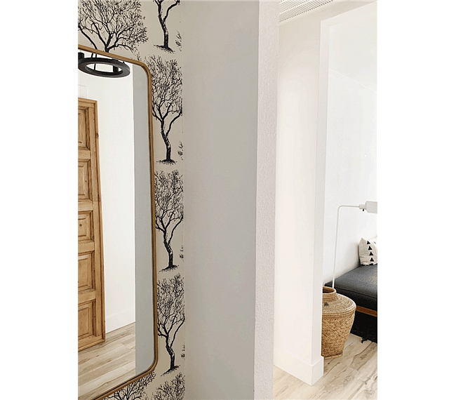 Give yourself a final look before heading out on the town in the modern full body wall mirror with custom wallpaper in the small hall.