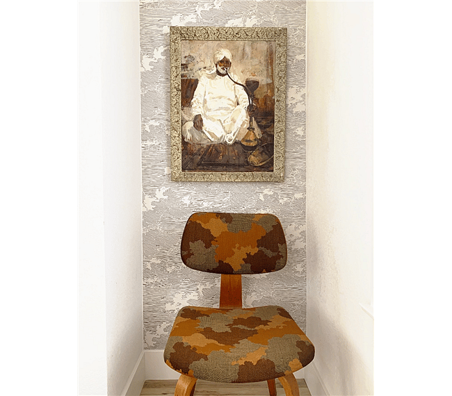 Enjoy original mid century art and furniture in the small master bedroom niche.