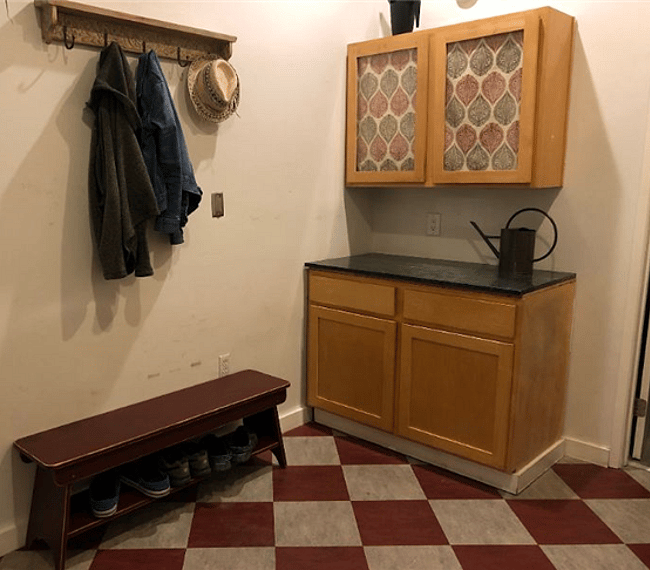 Place to hang coats and leave shoes in the laundry room. More storage here as well.
