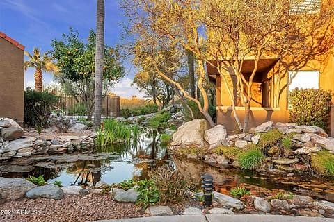 main entrance of complex, koi pond looking towards golf course