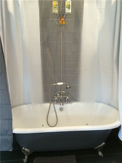 clawfoot tub/shower on "studio side"