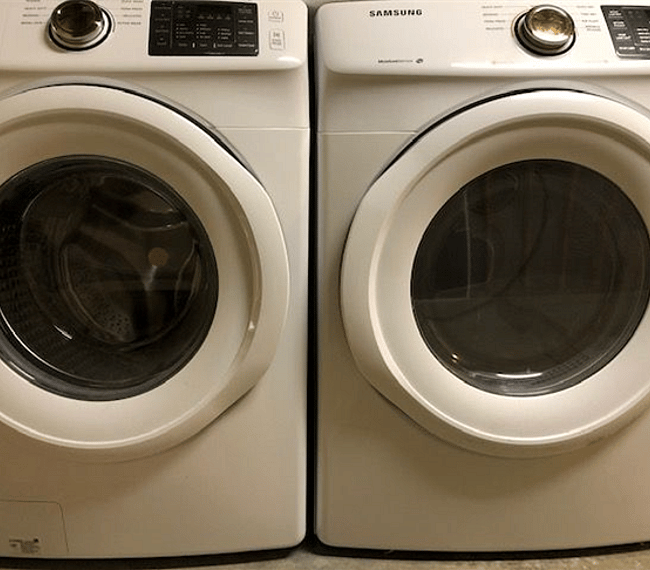 Utility room with washer and dryer.