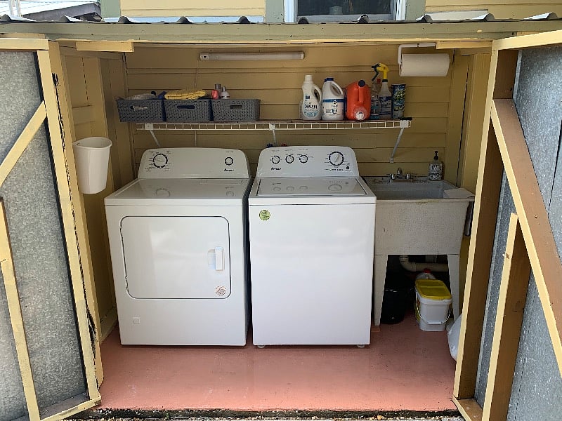 Shared laundry with owner out in the courtyard. Washer and dryer new 5/4/2023