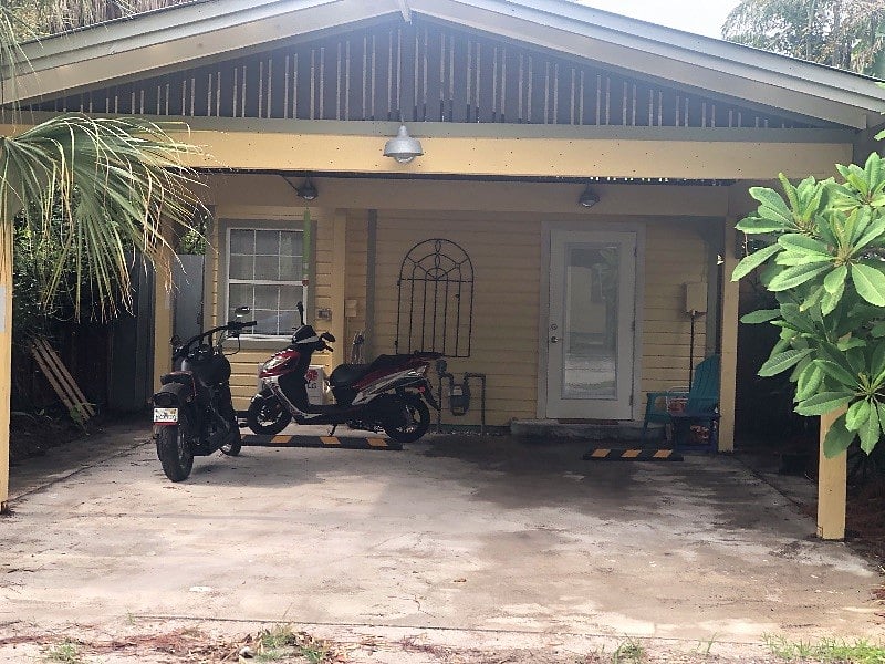 Parking for 1 vehicle under carport on the right. The door to the right is the entrance to the Studio Cottage