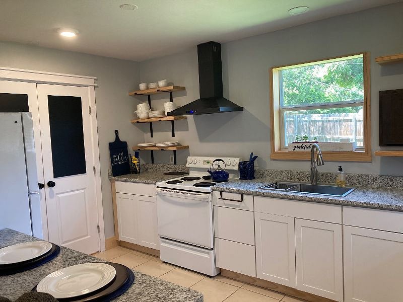 The double doors lead to the in unit laundry center with full size washer & dryer.