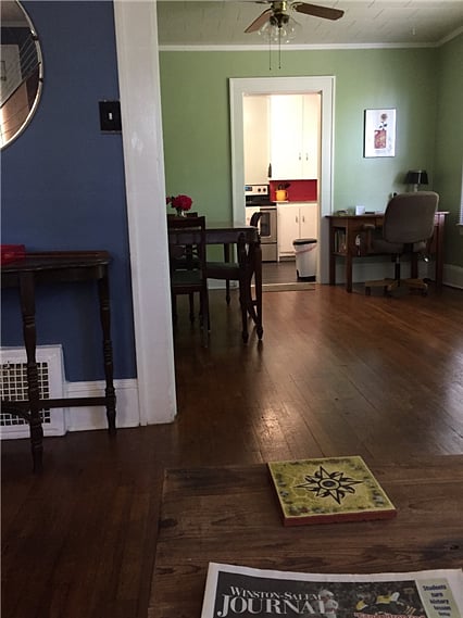 Looking from den through dining room to kitchen