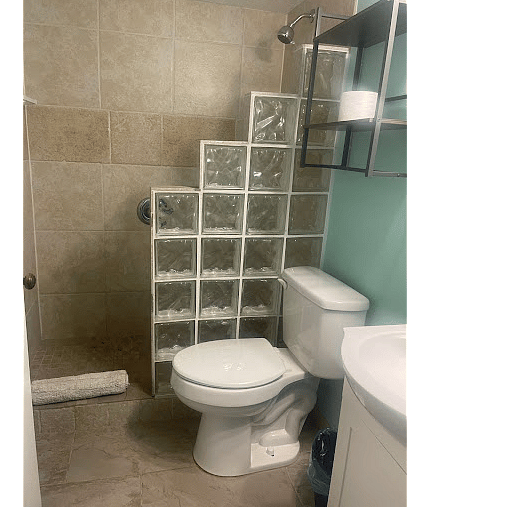 Bathroom walk in shower, toilet and sink