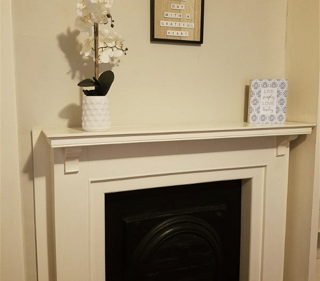 Decorative fireplace in main bedroom