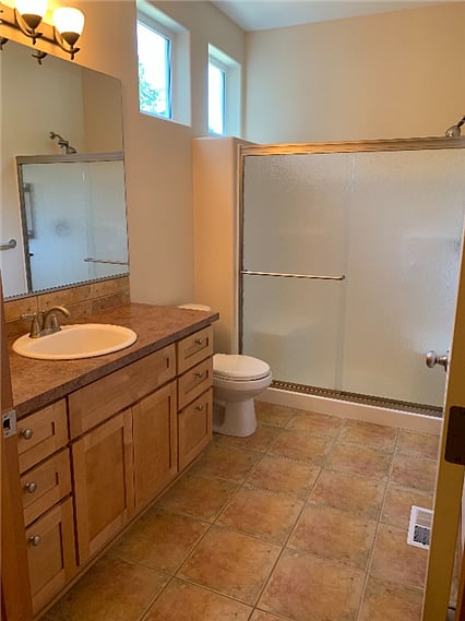 One of two en-suite bathrooms. Heated tile floor. Other bathroom has tub/shower combo