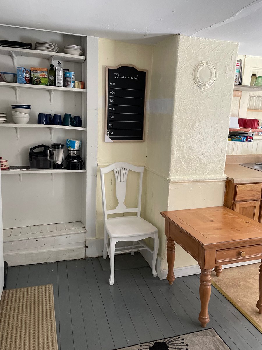 The kitchen has ample storage for pantry items and is a full-size room.