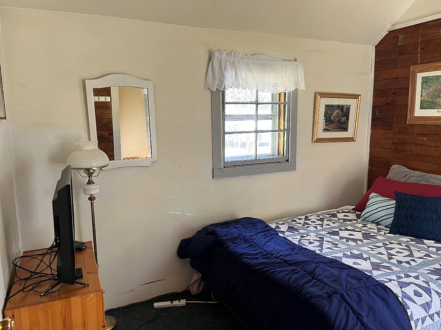 This is the east wall of the bedroom; you'll notice the original tongue-and-groove walls.
