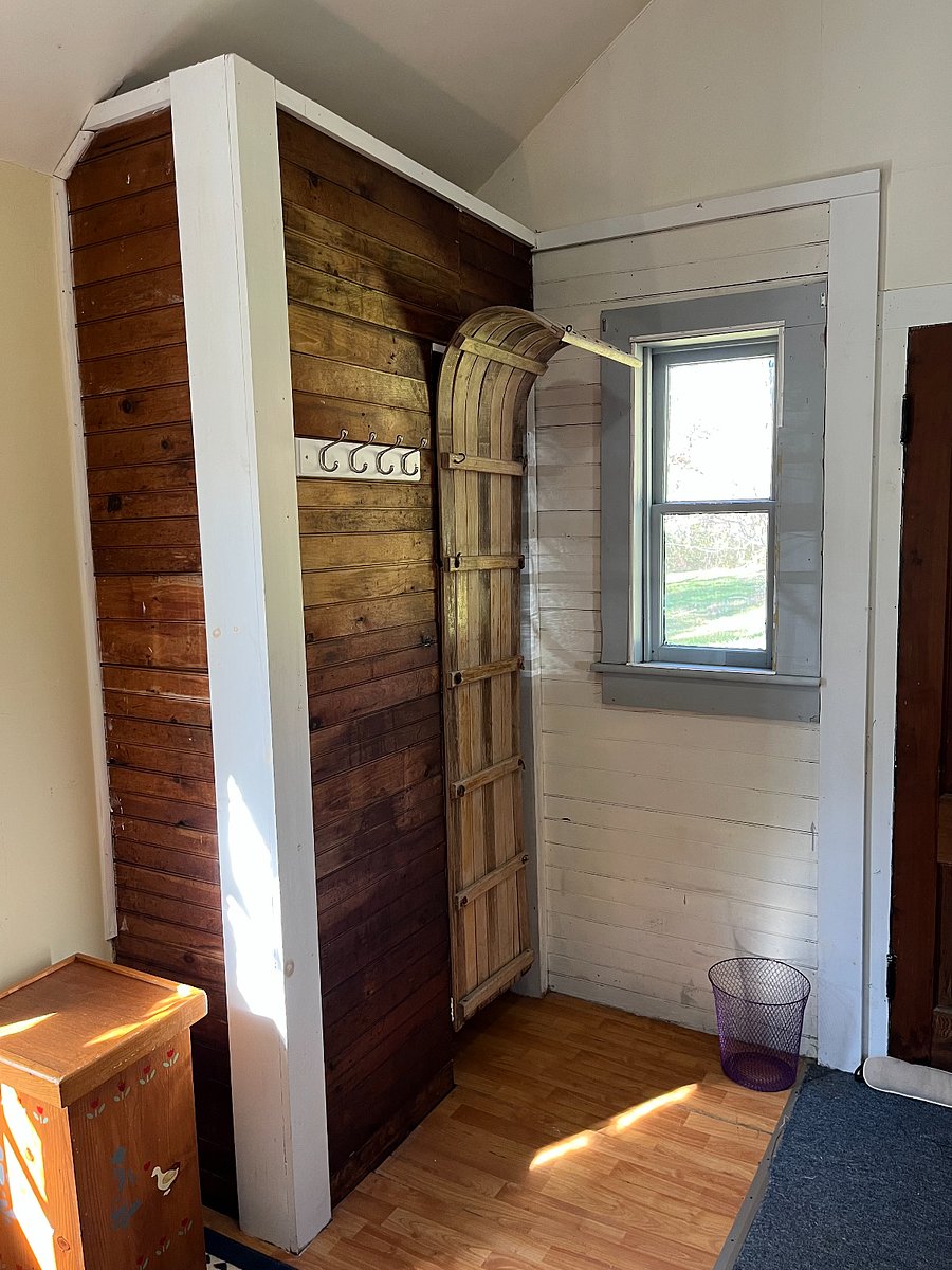 This is the closet in the bedroom; the use of a toboggan as its door adds a bit of whimsy. This is the northwest corner of the bedroom.