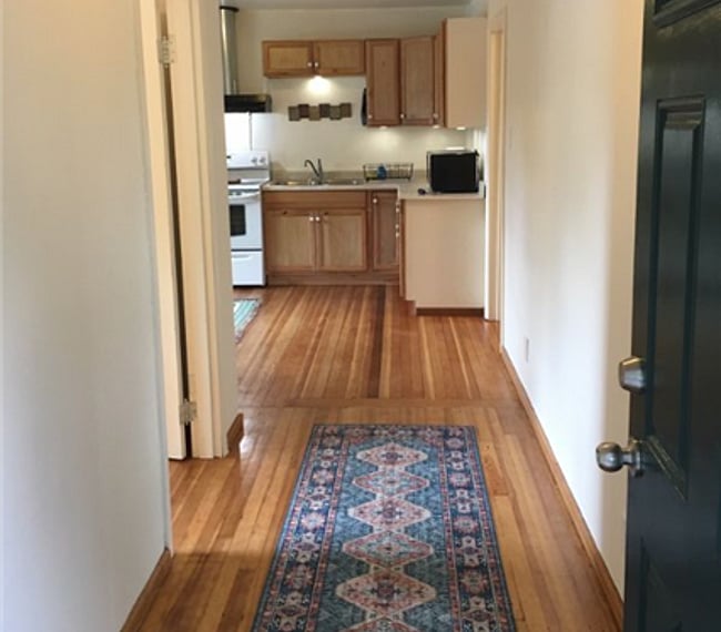 Front hall leads into kitchen and eating area