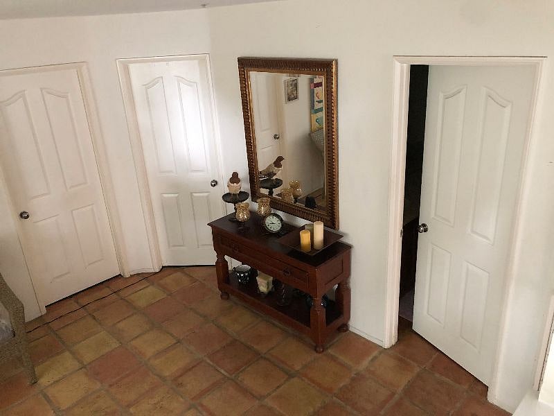 Interior Cozy Condo lower floor sitting area - doors to bathroom & bedroom