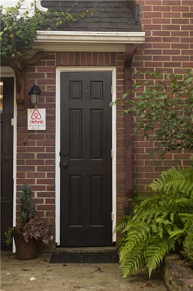Entry door to garage and apt