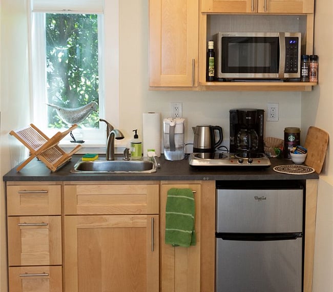Kitchenette with hotplate, micro-wave, mini-fridge, coffee pot, cookware, silverware