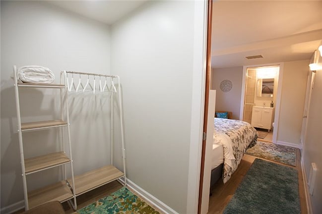 Spacious walk-in closet (5x8) with large full length mirror