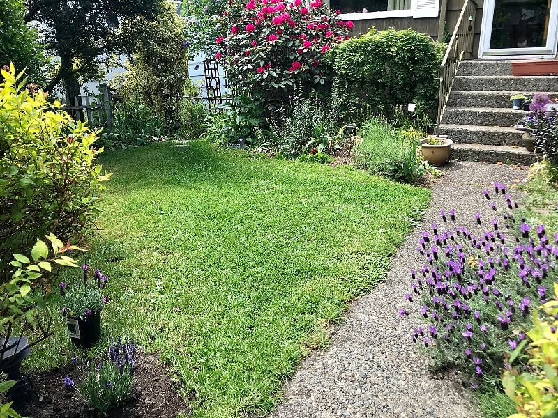 Pretty garden entry- apartment entry is along a garden path to the left of the home.