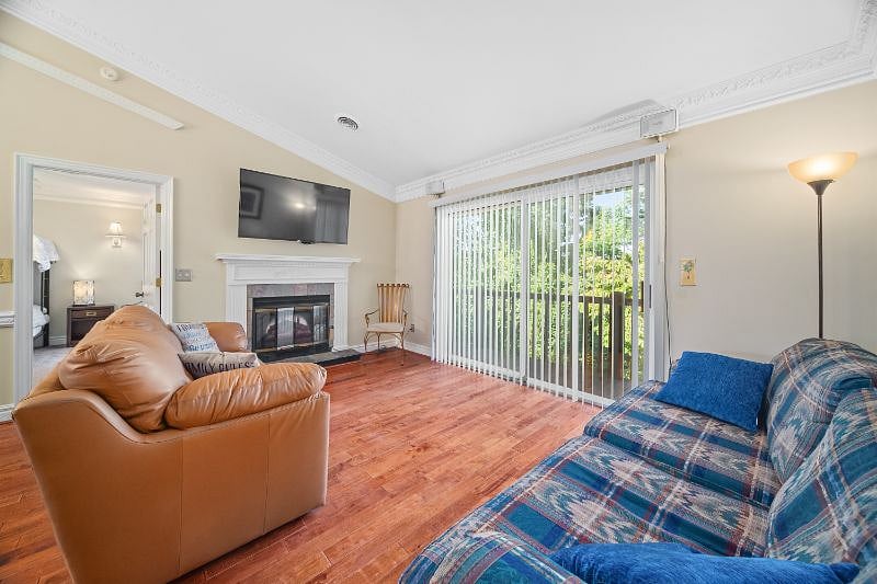 Living Room has Leather Sofa, Sleeper Sofa, Fireplace with Electric Heater Logs Insert and Smart TV 55"
