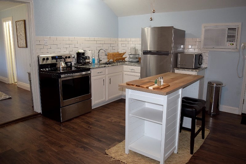 Kitchen, all new appliances, tableware/ cookware, coffee maker, microwave, kitchen island/ dinette