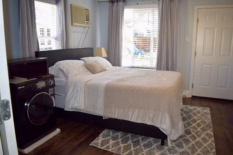 Bedroom, queen-sized platform bed, two bedside tables, washer/ dryer combo (1.6 cu ft), blackout curtains