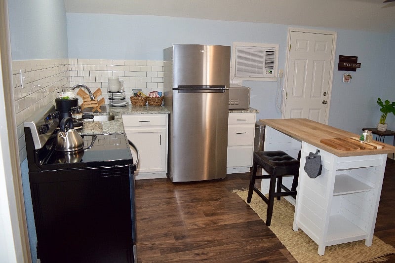Kitchen, all new appliances, tableware/ cookware, coffee maker, microwave, kitchen island/ dinette