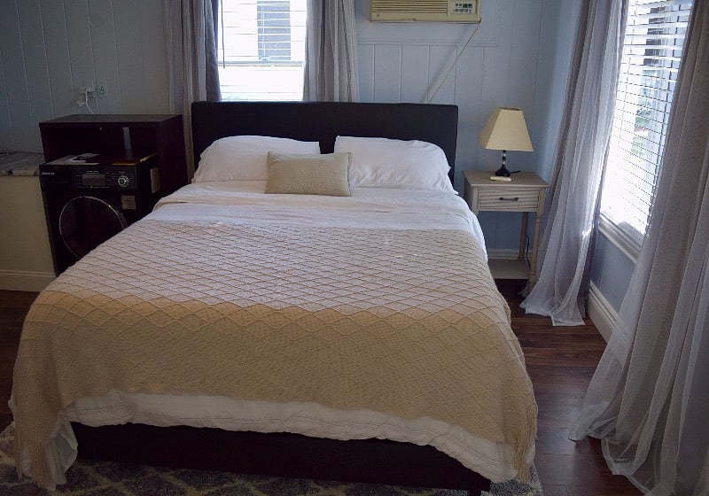 Bedroom, queen-sized platform bed, two bedside tables, washer/ dryer combo (1.6 cu ft), blackout curtains