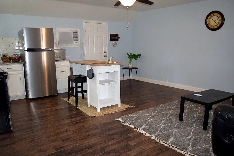 Another angle of living room area and of the main entrance to driveway