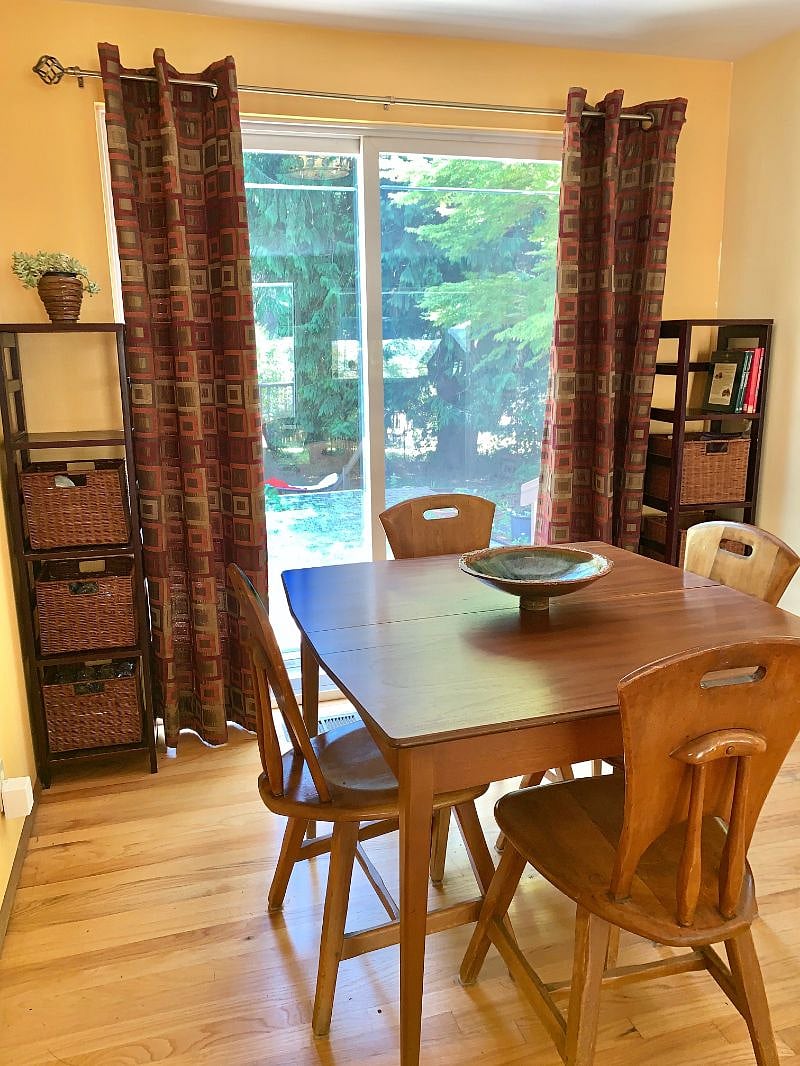 Dining space overlooking northwest inspired native growth backyard. 