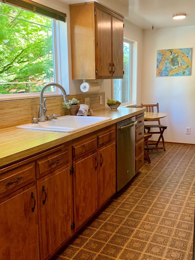 Eat in kitchen with access to the garage with full washer and dryer. 