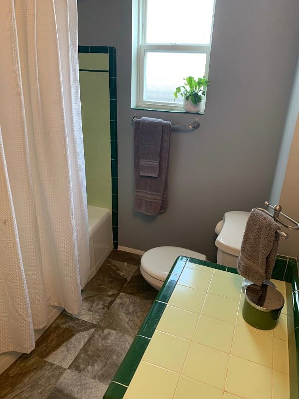 Vintage inspired bath, with full tub and shower. 