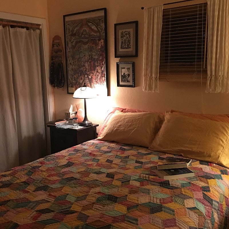 Standard size bedroom with queen bed, large dresser, chair and bedside table with 2 small drawers and closet.