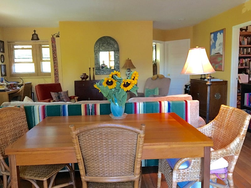 Looking into the great room from front entry doorway of flat. Dining room table off the kitchen with bedrooms off to the right