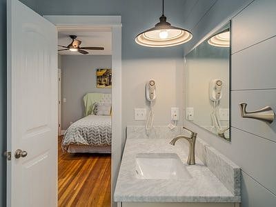 Bathroom with Shower-Tub Combination, Granite, Variable Lighting at Sink / Mirror, Hair Dryer
