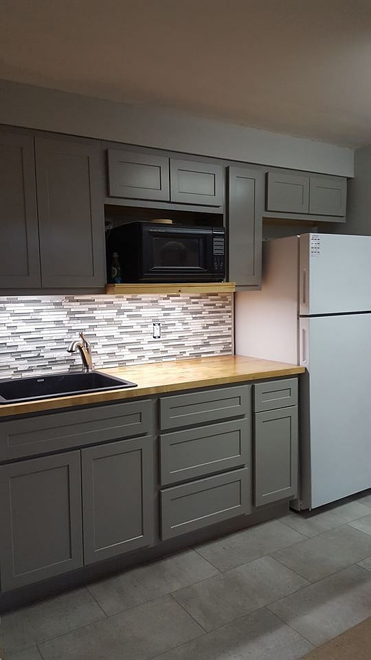 Kitchenette refrigerator with ice maker ,microwave  and  coffemaker.