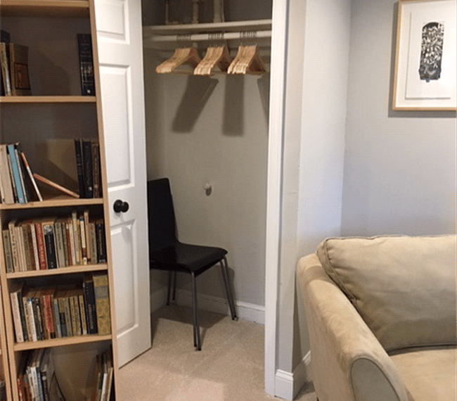 Hanging closet - two stored dining chairs