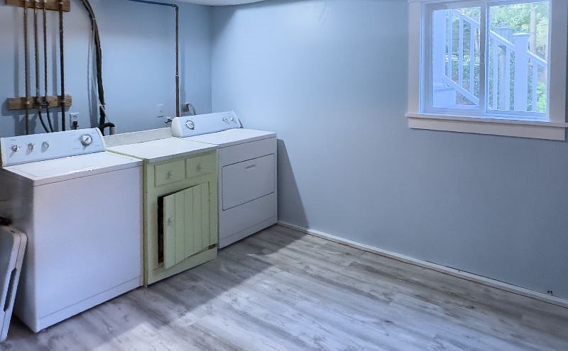 separate large capacity washer and dryer in spacious storage room on same level.