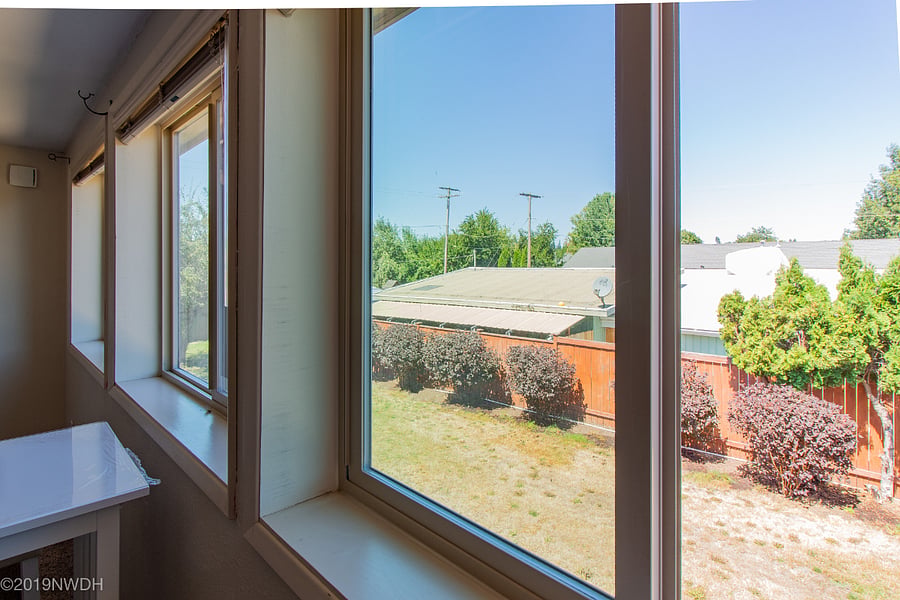 Views of large back yard through north-facing windows