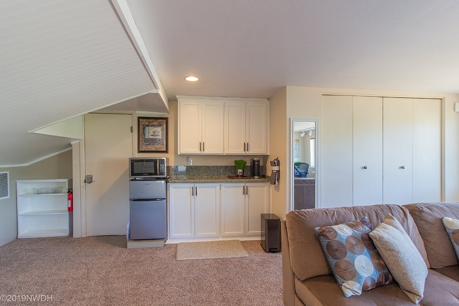 Kitchenette includes large mini-frig with separate freezer, microwave, toaster and keurig coffee maker