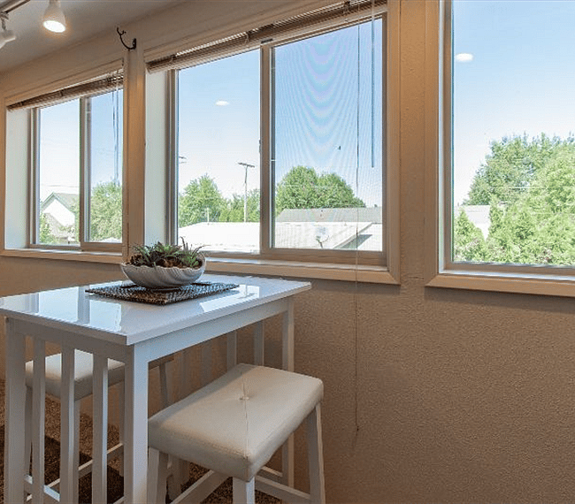 Enjoy your meals at this Bistro table overlooking the back yard. Note - picture taken before blackout curtains were installed