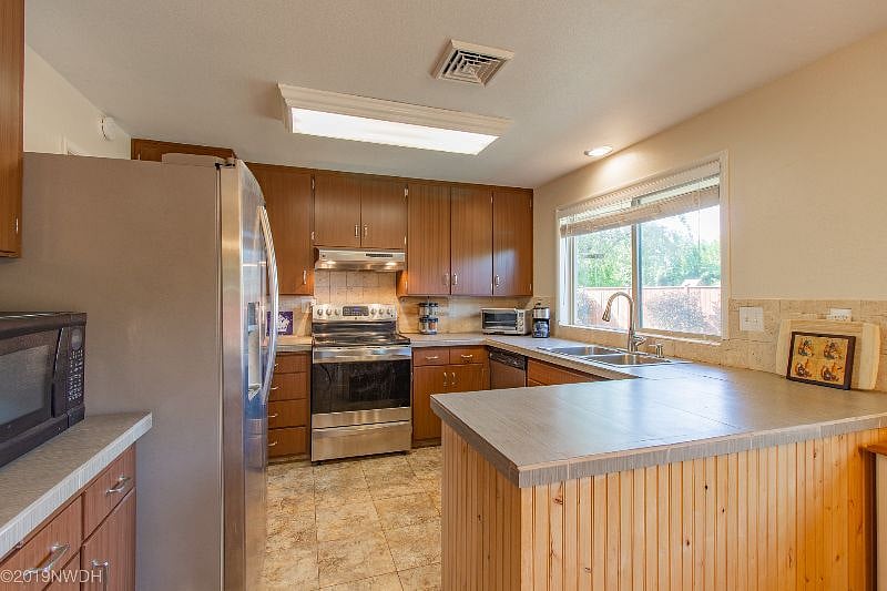 Downstairs: Well-stocked shared kitchen with dishware, glassware, cookware, etc
