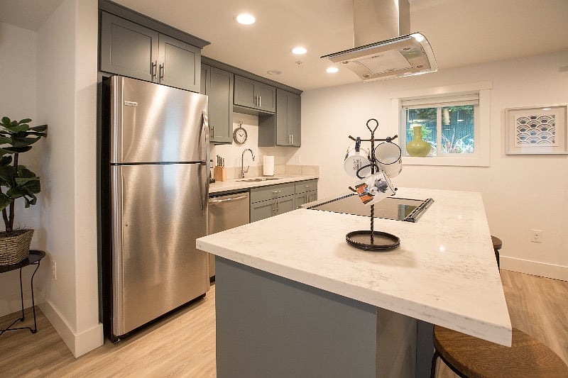 Quartz counters, Stainless Steel appliances, dishwasher and full size refrigerator