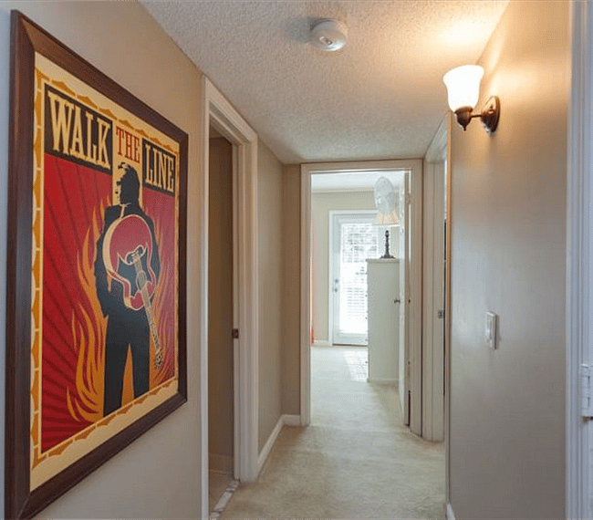 Hallway leading to two bedrooms and guest bathroom