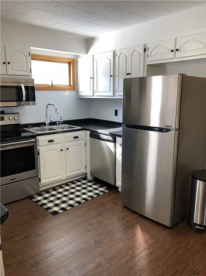 Full Kitchen with dishes, pots & pans, and utensils.