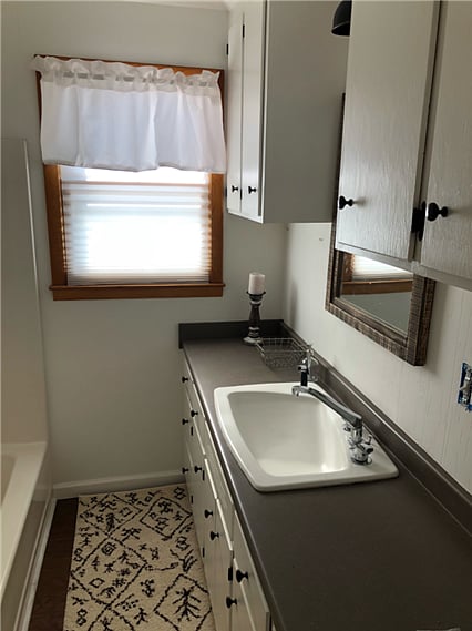 2 Identical Bathrooms with tub/shower combo and lots of counter space.