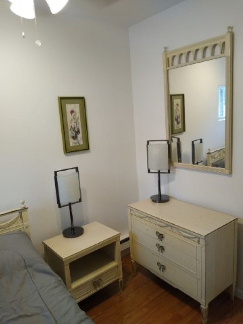 Night stand and dresser in bedroom