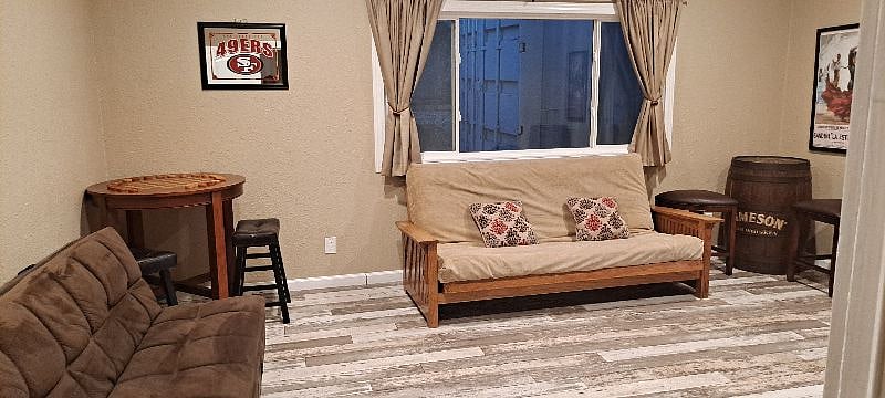 2nd bedroom has dark brown click clack 1 person futon and queen size futon very comfy