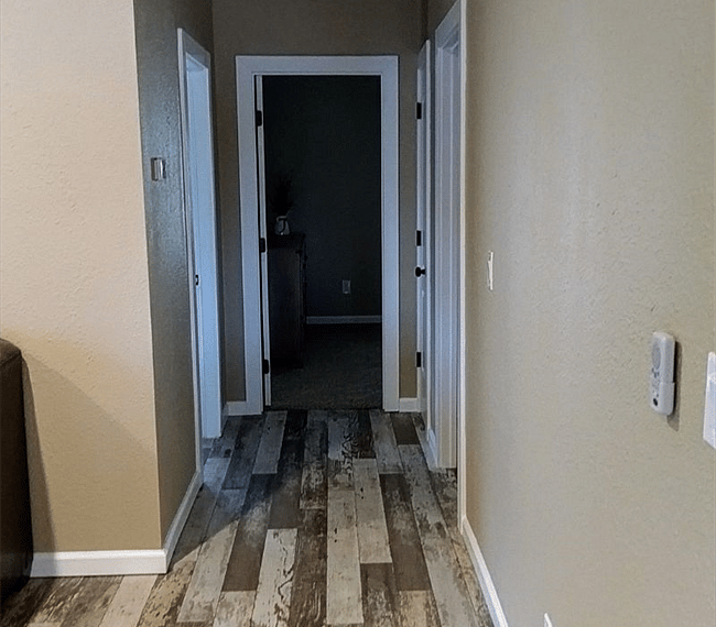 Hallway to bedrooms and bathroom